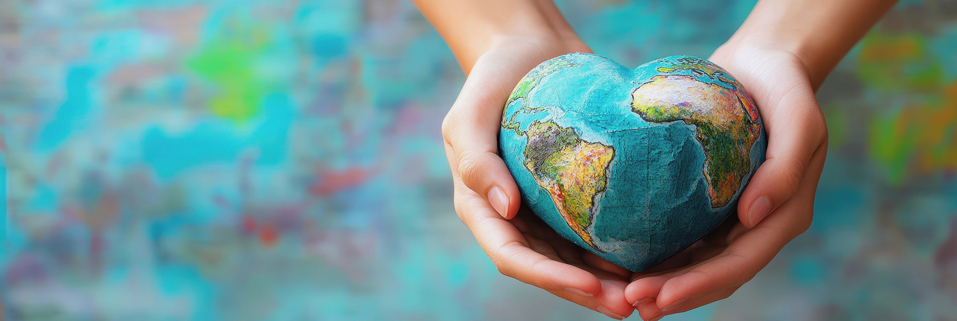 wamgroup social responsibility represented by a heart-shaped earth.